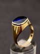 Middelfart 
Antik presents: 
14 carat 
gold ring with 
sapphire 
colored 
gemstone