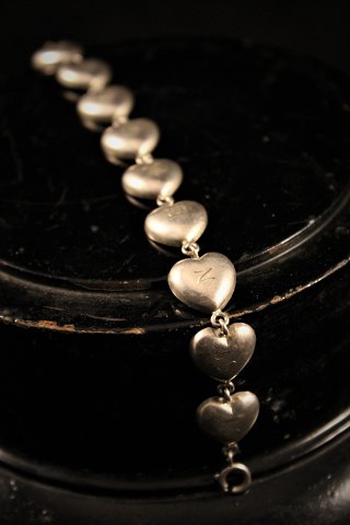 Old children bracelet in silver in the form of little hearts with "Anne Marie" 
engraved...