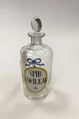 Holmegaard  Apotekerflasken, krukke med tekst SPIR COCHLEAR fra 1981