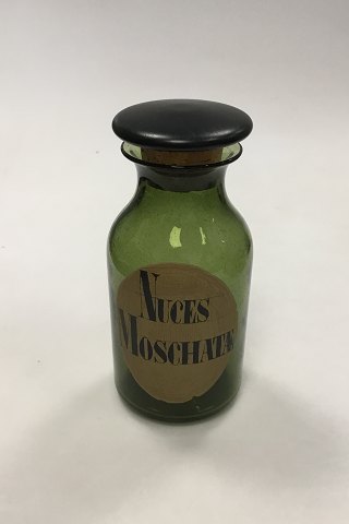 Holmegaard  Apotekerflasken, krukke med tekst Nuces Moschatæ fra 1985
