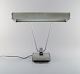 Eileen Gray 1878-1976. Art deco chromed iron desk lamp, gray lacquered. 
Adjustable arm and screen. Produced by Jumo, France in the 1930
