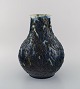 Svend Hammershøi for Kähler, Denmark. Rare and early vase in glazed stoneware. 
Blue foliage on cream colored background. Ca. 1910.
