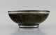 Wilhelm Kåge (1889-1960) for Gustavsberg. Argenta art deco skål i glaseret 
keramik. Smuk glasur i mørkegrønne nuancer med sølvindlæg. Dateret 1937.
