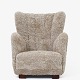 Roxy Klassik 
presents: 
Danish 
Cabinetmaker
Upholstered 
easy chair in 
new lambskin 
with legs in 
patinated oak 
...