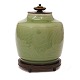 Celadon glazed lidded jar by Georg Thylstrup for Royal Copenhagen #2499. Bronze 
base and lid by Knud Andersen. Nice condition. H: 22cm