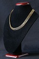 Antik Huset 
presents: 
Gold 
necklace in 14 
carat gold with 
V pattern and 
box lock. 
Stamped 585.