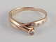 L'Art presents: 
Danish 
goldsmith. 8 
karat gold 
ring.
Adorned with 
four 
brilliant-cut 
diamonds.