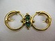 Jugend/skønvirke brosche fremstillet i Danmark ca. 1900 i 8 karat guld med to grønne granater ...
