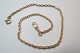 Kæde til herre lommeur i 14 karat guld. Længde 39,5 cm og bredde 0,4 cm. Vare nr. 216143.