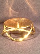 Georg Jensen.Lysestage til bloklys.Lysestagen er udført i stål som er belagt med 24 karat ...