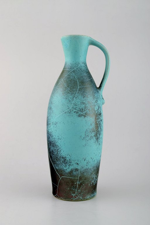 Richard Uhlemeyer, German ceramist.
Pottery pitcher, beautiful crackled glaze in green red shades.