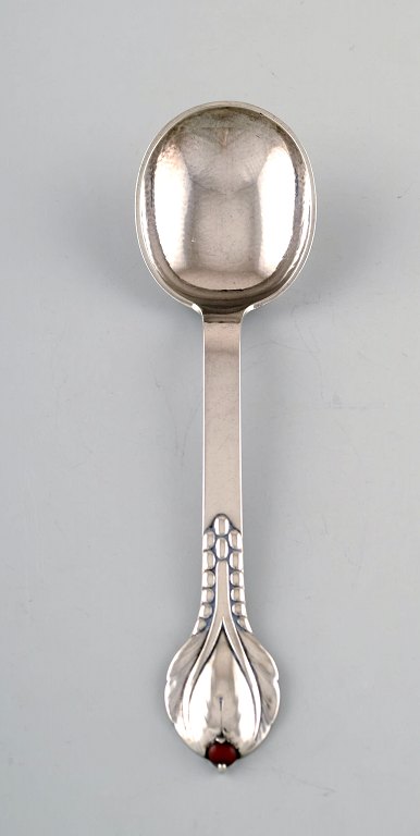 Evald Nielsen number 3, serving spoon in hammered all silver with cabochon coral 
bead. 1920