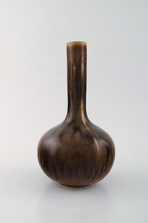 Axel Salto for Royal Copenhagen. Vase in glazed stoneware. Beautiful glaze in 
chestnut colored shades.
1940 / 50