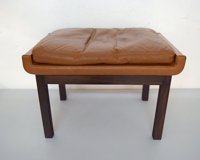Finn Juhl for France & son. Rosewood stool with brown leather cushion. Danish 
design, 1960