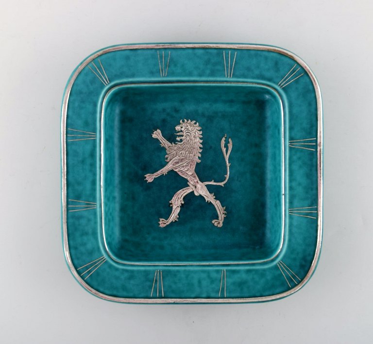 Wilhelm Kåge, Gustavsberg, art deco Argenta dish in ceramics decorated with lion 
in silver inlaid.
Sweden 1940