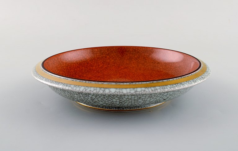 Royal Copenhagen. Skål i krakeleret porcelæn med guld og orange dekoration. 
1930