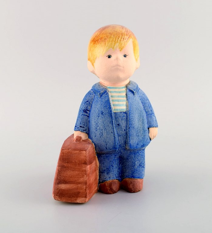 Lisa Larson for Gustavsberg. Rare figure in glazed ceramics. Boy with bag. 1970 
/ 80s.
