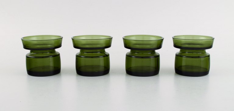 Jens Harald Quistgaard. Fire "Hyggelys" til fyrfadslys i mørkegrønt kunstglas. 
Retro, 1960