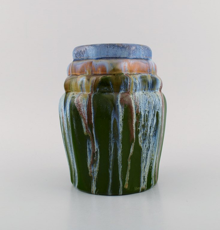 European studio ceramicist. Unique vase in glazed ceramics. Beautiful polychrome 
running glaze. Mid-20th century.
