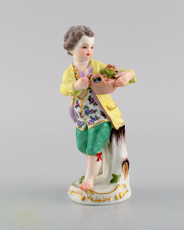 Antique Meissen porcelain figurine. Boy with flower basket. Model 149. Approx. 
1900.
