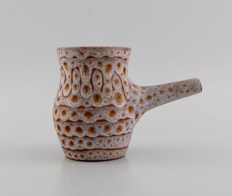 European studio ceramicist. Unique jug in glazed stoneware. Beautiful glaze in 
bright earth tones. 1960s / 70s.

