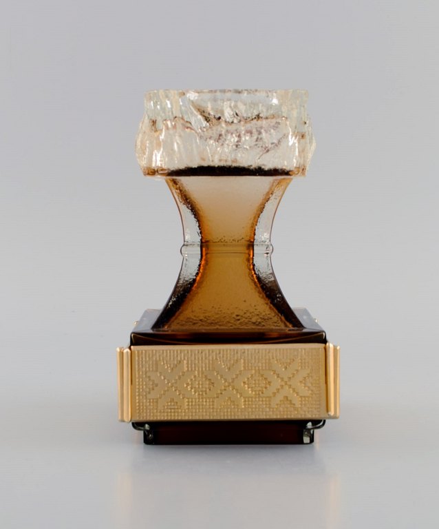 Pentti Sarpaneva for Turun Hopea. Maljakko candlestick in smoky art glass with 
brass mounting. Finnish design, 1960s.
