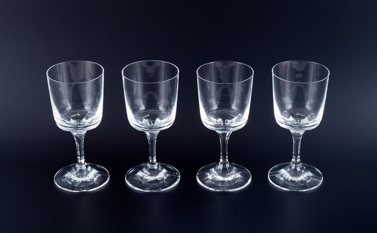 A set of four René Lalique Chenonceaux red wine glasses.
Clear mouth-blown crystal glass with facet-cut stem.