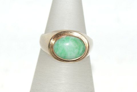 Gold ring with green stone