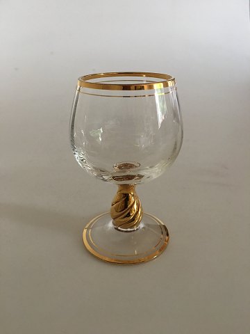 Holmegaard "Ida" cognac glas med guld på stilk, rand og fod. 