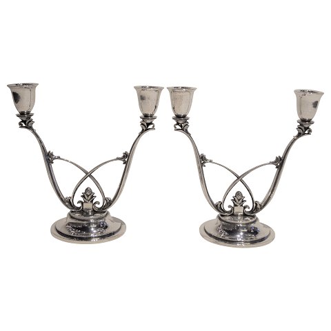 Georg Jensen, Harald Nielsen; A pair of "Acorn" candlesticks of sterling silver 
#619