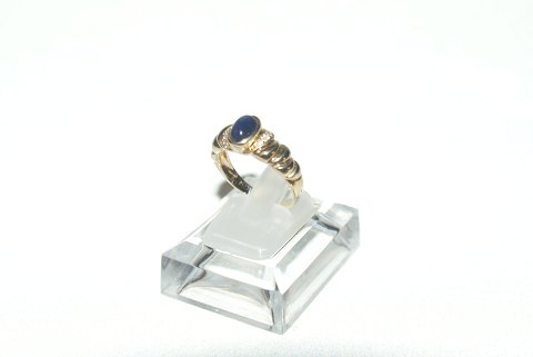Elegant Damering with blue stone 14 carat gold