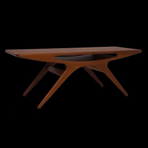 Johannes Andersen, Denmark: "The Smile" teak 
table. H: 49cm. Top: 52x135cm