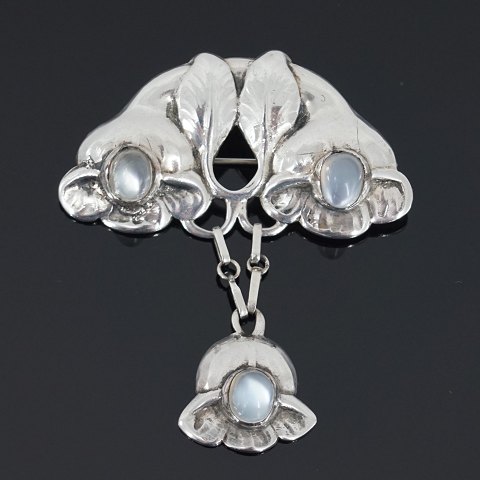Evald Nielsen; A jugend brooch of silver set with moonstones