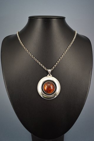 Niels Erik From; A necklace of sterling silver set with amber