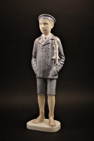 Rare porcelain figurine from Bing & Grondahl 
(year 1915) 
of boy with skates. H:29,5cm....