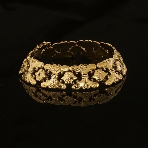 Bernhard Hertz, København: Leddelt armbånd i 14kt 
guld. L: 19,5cm. B: 14mm V: 15,8gr