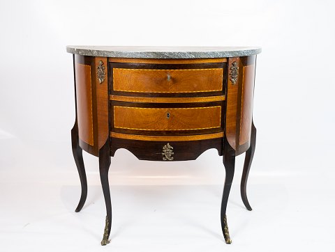 Rococo chest of drawers in dark wood with marble table top from the 1920s.
5000m2 showroom.