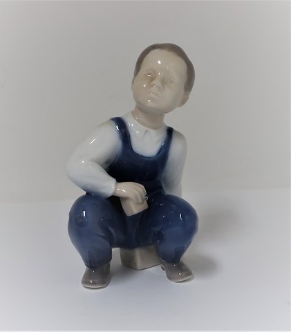 Bing & Grondahl. Porcelain figure. Sitting boy. Model 2402. Height 12 cm. (1 
quality)