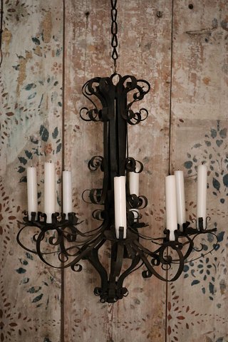 Old raw French metal chandelier with a super patina 
and with room for 8 candles...