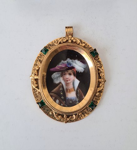 Victorian necklace, miniature portrait painted on porcelain, set in gilded 
medallion surrounded by emerald green glass stones about 1850