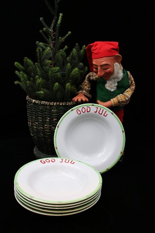 Håndmalet julestel i fajance fra Gustafsberg , dyb tallerken med granguirlande 
på kanten og God Jul...