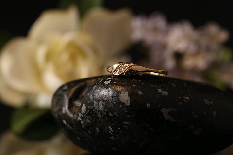 Unique gold ring in 14 carat gold and white zircon. Great design and special look. Size 56.