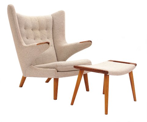 Hans J. Wegner “Papa Bear”. Wingback teak easy 
chair with matching stool. AP 19 and AP 29