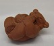 Royal Copenhagen Art Pottery Un glazed red clay
21434 RC Brown bear cub - sucking paw on back 5 x 8 cm (1 49 234) Knud Kyhn, 
1957