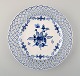 11 antikke KPM, berlin gennembrudte flade tallerkener, blå dekoration med 
blomster og sommerfugl.