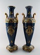A pair of large 19 c. Sevres style floor vases in beautiful darkblue color.
