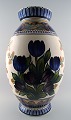 Aluminia faience monumental vase, hand painted with floral motifs.
