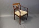 Armchair in polished mahogany decorated with inlaid fruitwood and upholstered in 
light fabric. 
5000m2 showroom.