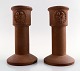 Gustavsberg. A pair of unglazed candlesticks in stoneware.