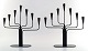 A pair of Ystad metall, Gunnar Ander seven-armed candelabras in metal with brass 
top. Swedish design.